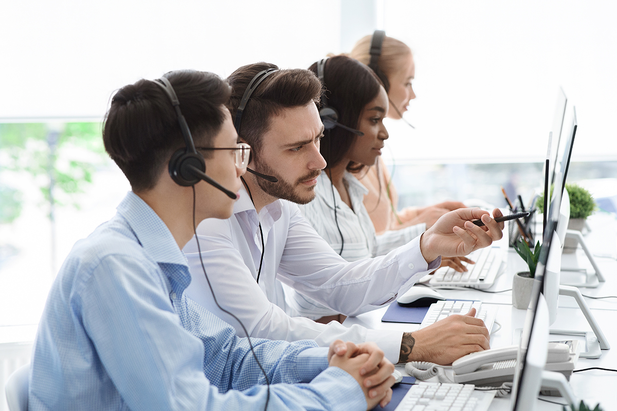 Technical support operators solving problem with client communication at call centre